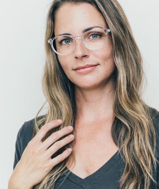 Woman wearing clear glasses.
