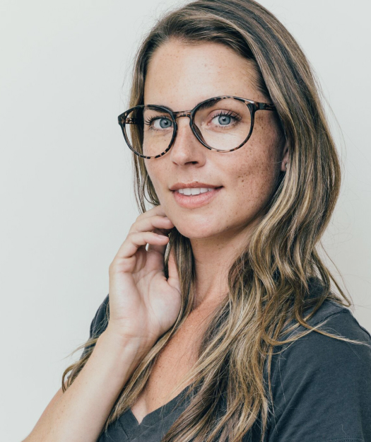 Woman wearing large glasses.